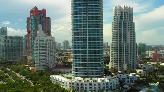Aerial pull out footage Miami Beach highrise luxury condos 4k