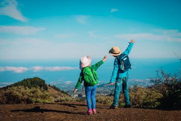 happy little boy and girl travel in nature