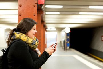 Fototapeta na wymiar Lady at a subway commuting to work