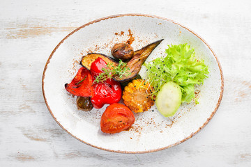 Grilled vegetables in a plate. Rustic style. Top view. Free space for your text.