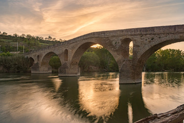 Fototapeta na wymiar Puente la Reina (Bridge of the Queen) bridge over the Arga river. Navarra, Spain