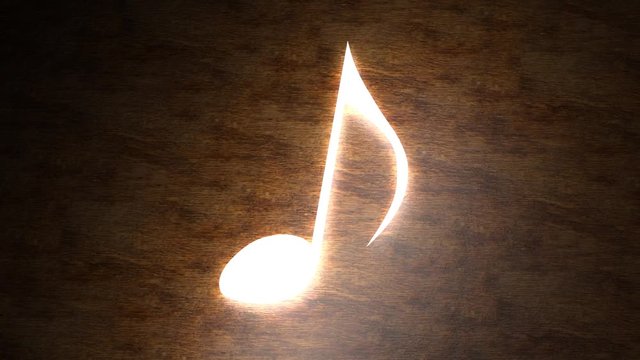Glowing musical note on the table. The magic of music. Note with rays of light. 96