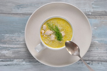Chicken soup. Hot winter soup with chicken and potatoes. Chowder soup with chicken and potatoes. Fresh creamy soup with chicken and vegetablesin white bowl on the wooden background. Healthy food