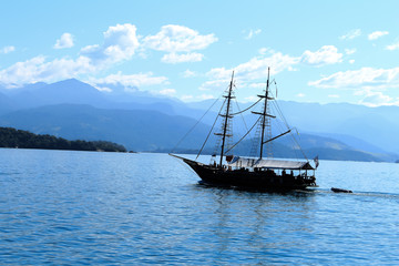 Fototapeta na wymiar Boats sailing in the sea. Beautiful blue sea.