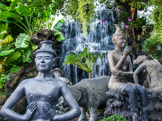  yoga statue and water fall in thailand bangkok