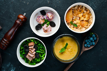 Collection of take away foil boxes with healthy food. Set of containers with daily meals. Top view. Free copy space.