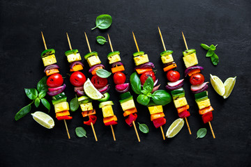 Vegetarian skewers on dark background