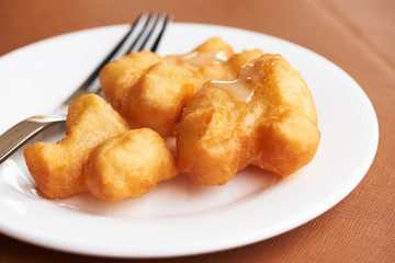 A plate of delicious deep fried dough stick