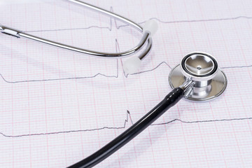 Stethoscope or phonendoscope on the paper electrocardiogram. Medical examination