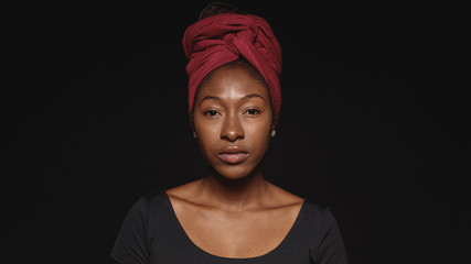 Portrait of an african woman in a headwrap - 268352640