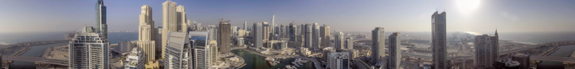 Fototapeta na wymiar DUBAI - DECEMBER 5, 2016: Dubai Marina skyscrapers, aeril view. The city attracts 15 million visitors every year