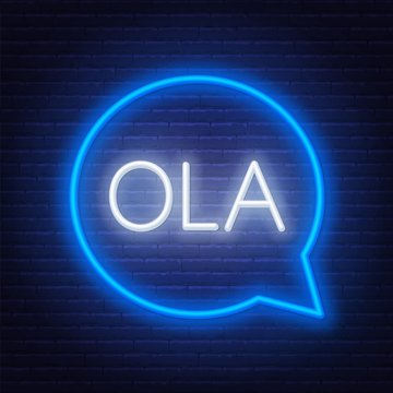Neon sign of word Ola in speech bubble frame on dark background. Greetings in Portuguese. Light banner on the wall background.
