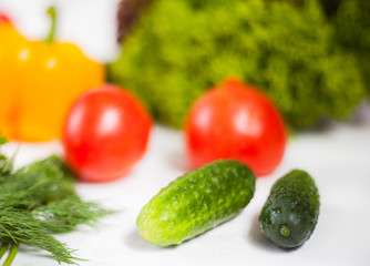 fresh vegetables and greens on white background