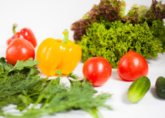 fresh vegetables and greens on white background