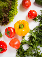 fresh vegetables and greens on white background