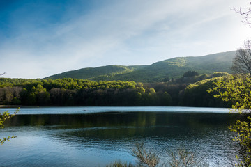 Deep blue lake in catalonia with background forest