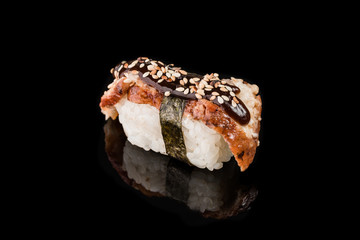 Sushi Roll - Maki Sushi pieces collection with Salmon Roe, Smoked Eel, Cucumber, Cream Cheese, Sesame, Avocado, Onion Fries, Crab Meat, Tobiko isolated on black background - Image
