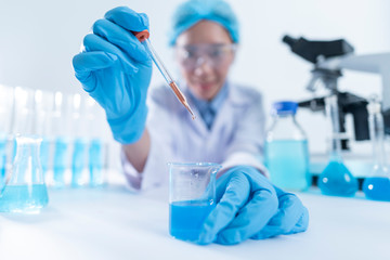 researcher working with glassware, glass equipment in scientific genetic laboratory. Healthcare and...