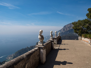 Italy, april 2019: Ravello, Villa Cimbrone in a sunny summer day, infinite terrace and white statues over the Amalfi Coast coastline.