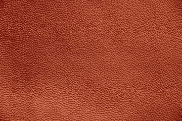 Fototapeta premium The texture of genuine leather. Impeccable and stylish background. Beautiful stylish background. Natural skin texture close up. Brown background. The structure of the leather material brown shades.