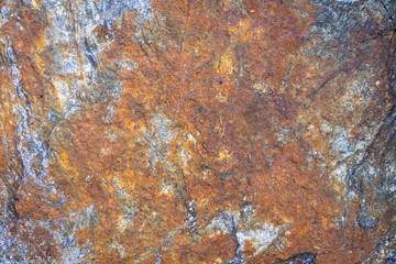 Rusty texture. Stone rusty background. Colorful granite stone background. Old Cracked Rusty Rough texture. Rock wall backdrop with rough red brown texture. Grunge Abstract Stone Surface. 
