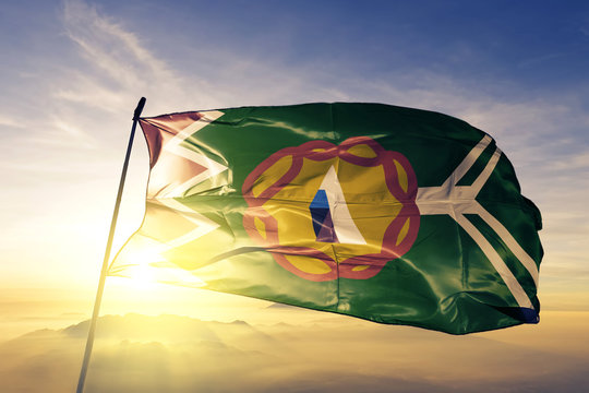 Ngabe-Bugle comarca of Panama flag waving on the top sunrise mist fog