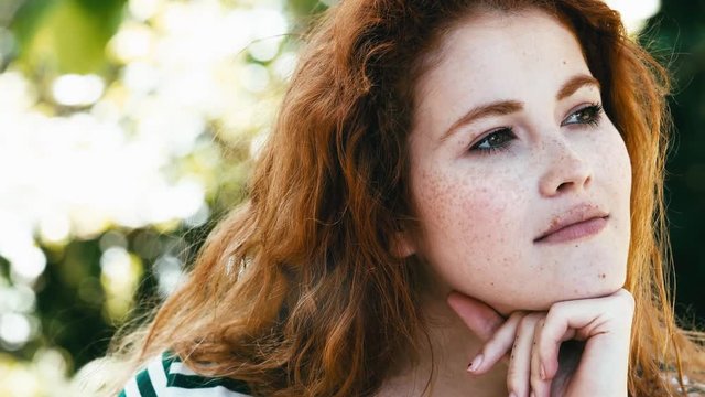 Close-up of eyes of beautiful woman with freckles