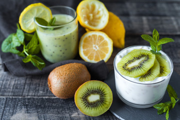 Homemade proteic greek yogurt with kiwi, lemon and mint and healthy shack of kiwi, banana and lemon