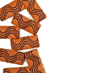 Cake bars filled with cream and decorated with dark chocolate isolated on white background.