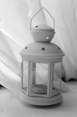 lantern with an overhang on a table in the background