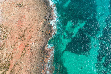 Sea coast on the island, aerial view from above top.