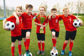 Happy Young Boys In Football Team
