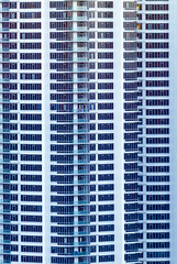 Highrise enormous condo building facade in white.  Ultra modern.