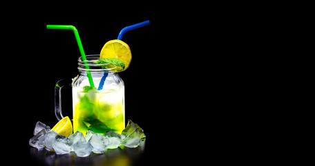 Iced lemonade on black background.
