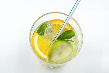 Glass of drink with citrus juice