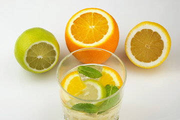 Glass of drink with citrus juice