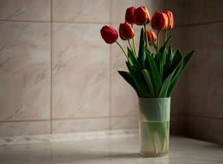 Still life with tulips bouquet on wooden table