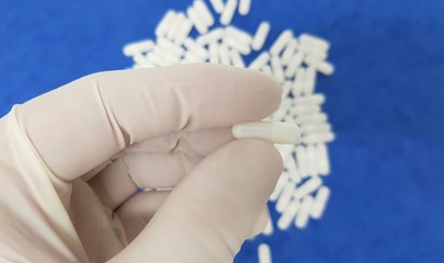 White capsules on blue background