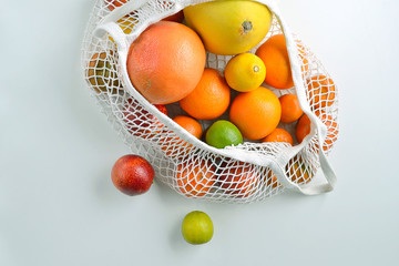 citrus fuits in cotton mesh reusable bag