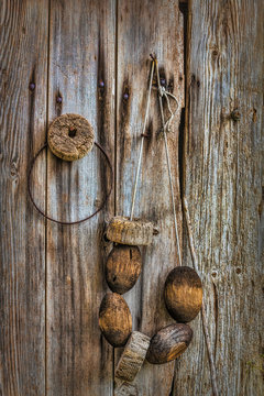 Fishing floats hanging on wooden cabin wall