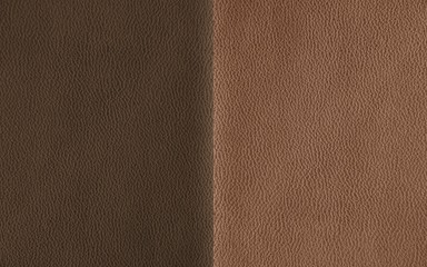 Fototapeta premium The texture of genuine leather. Impeccable and stylish background. Beautiful stylish background. Natural skin texture close up. Brown background. The structure of the leather material brown shades.