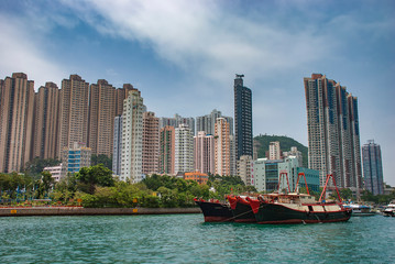 Fototapeta na wymiar The urban skyline around the waterfront in the Aberdeen district of Hong Kong