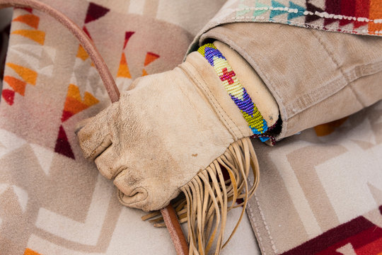 Midsection of cowboy in traditional clothing