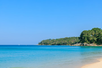 Fototapeta na wymiar Crystal clear turquoise blue Andaman sea at Surin Beach, Phuket, Thailand