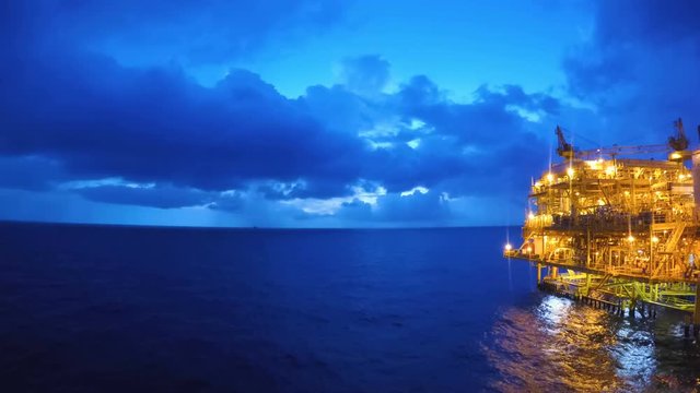Day to night time lapse offshore with beautyful storm or raining in background
