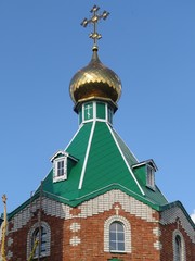 Golden dome of the brick church in Chuvashia