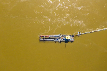 Water pump on the river bank on a big boat. Aerial view