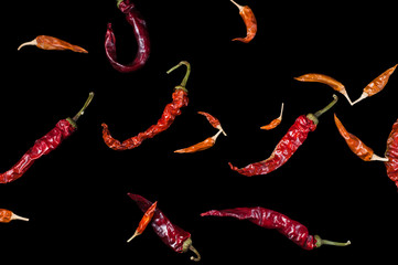 dried cayenne red pepper pod on black background, isolate