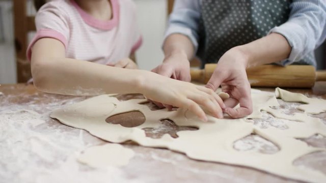 family lay-up baking cookies on the baking sheet to cook it with flow camera