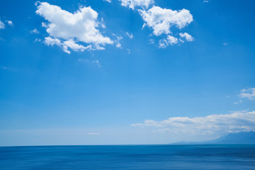Naklejka na ściany i meble Blue sea and sky background